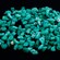 A pile of precious stones with holes drilled into them